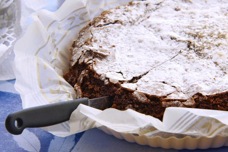 a gluten-free chocolate cake on parchment paper