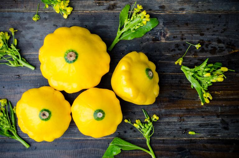 Yellow patty pan squash on a table